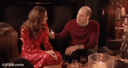 A Group Of People Are Sitting Around A Table With Glasses Of Wine And Candles . GIF