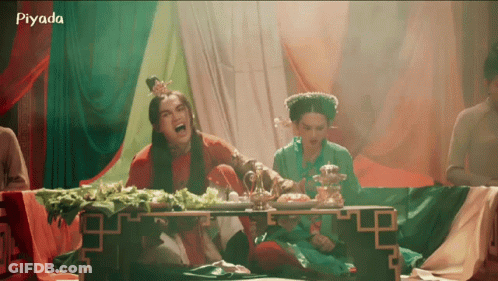A Group Of People Are Sitting Around A Table With The Word Piyada On The Bottom Right GIF