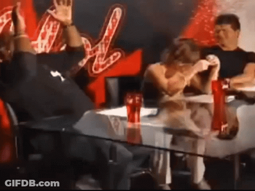 A Group Of People Are Sitting At A Table With Coca Cola Bottles On It GIF