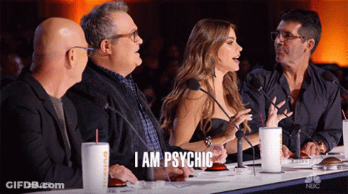 A Group Of People Are Sitting At A Table With Microphones And One Of Them Says I Am Psychic GIF