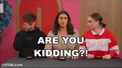 A Group Of People Are Sitting At A Table With The Words " Are You Kidding " Written On The Screen GIF