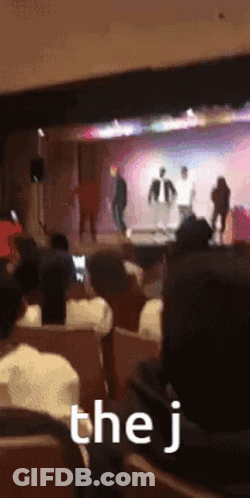 Audience Watching Stage With J Sign GIF