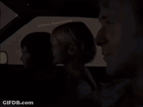 A Group Of People Are Sitting In A Car . GIF
