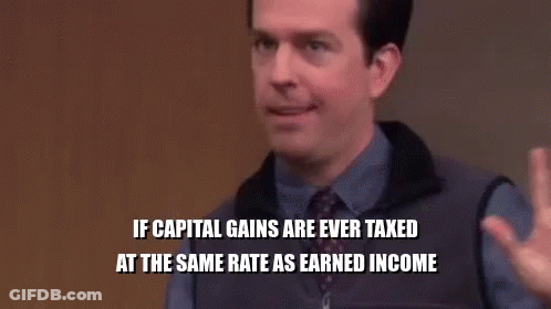 A Group Of People Are Sitting In A Room With A Man In A Purple Shirt And Tie Sitting In Front Of Them . GIF