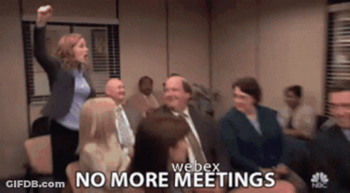 A Group Of People Are Sitting In A Room With The Words No More Meetings GIF