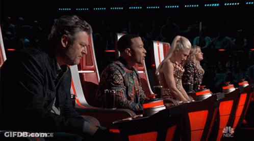 A Group Of People Are Sitting In A Theatre With A Nbc Logo In The Corner GIF