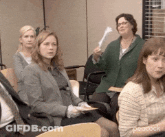A Group Of People Are Sitting In Chairs In A Room With Peacock Written On The Bottom GIF