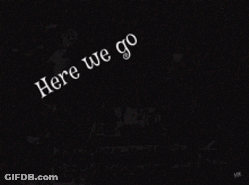 A Group Of People Are Sitting In Front Of A House With The Words `` Here We Go '' Written On It . GIF