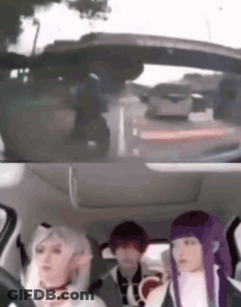 A Group Of People Are Sitting In The Back Seat Of A Car Looking Out The Window . GIF