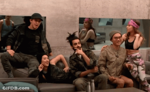A Group Of People Are Sitting On A Couch And One Of Them Is Wearing A Headband GIF