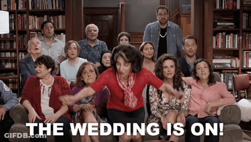 A Group Of People Are Sitting On A Couch With The Words The Wedding Is On GIF