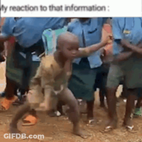 A Group Of People Are Standing Around A Little Boy Who Is Dancing . GIF