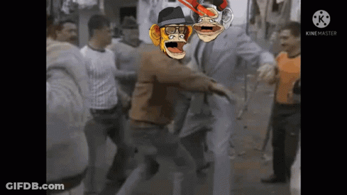 A Group Of People Are Standing Around A Man With A Monkey On His Head GIF