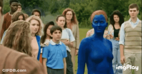 A Group Of People Are Standing Around A Woman In A Blue Bodysuit . GIF