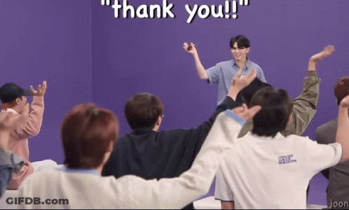 A Group Of People Are Standing In A Circle With Their Arms Outstretched And The Words Thank You Written In White GIF