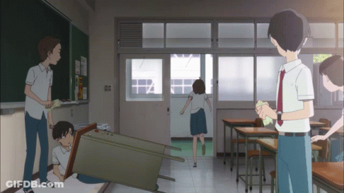 A Group Of People Are Standing In A Classroom With A Blackboard That Says ' I 'M Sorry ' On It GIF