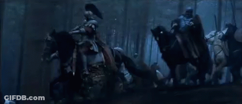 A Group Of People Are Standing In A Dark Forest With The Words Hold The Line GIF