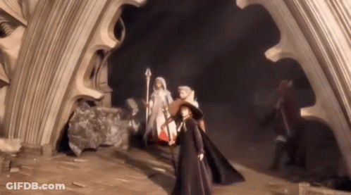 A Group Of People Are Standing In A Dark Room Holding Swords GIF