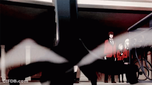 A Group Of People Are Standing In A Dark Room With A Black Object In The Middle GIF