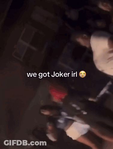 A Group Of People Are Standing In A Dark Room With The Words We Got Joker Irl On The Bottom GIF