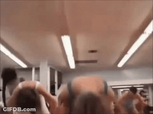 Group Of People Standing In Gym GIF