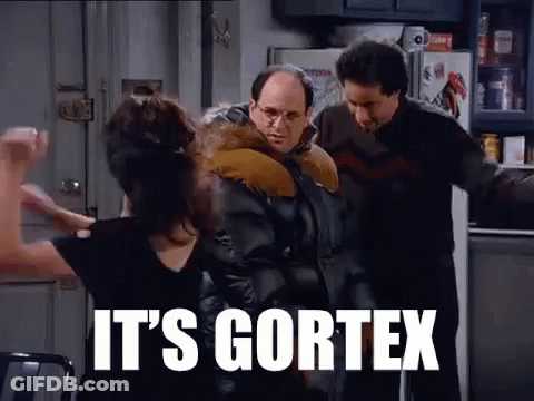 A Group Of People Are Standing In A Kitchen With The Words `` It 'S Cortex '' On The Screen . GIF