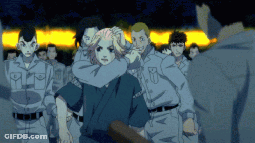 A Group Of People Are Standing In A Line And One Of Them Has A Shirt That Says ' Tokyo Ghoul ' On It GIF