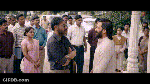 A Group Of People Are Standing In A Line And One Of Them Is Wearing A Pink Saree GIF