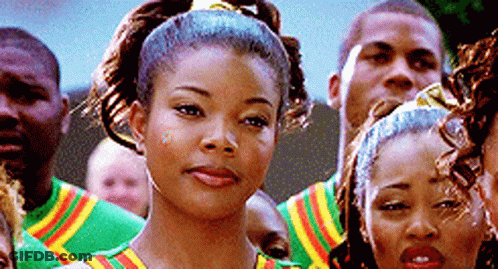 A Group Of People Are Standing In A Line And One Of Them Is Wearing A Ponytail . GIF