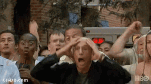 A Group Of People Are Standing In A Line With Their Hands On Their Head . GIF