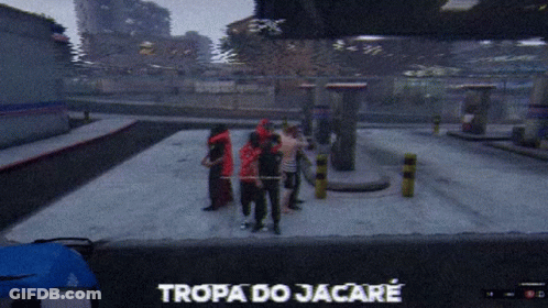 A Group Of People Are Standing In A Parking Lot And The Words Tropa Do Jacare Are On The Screen GIF