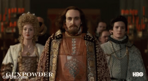 A Group Of People Are Standing In A Room And The Word Gunpowder Is On The Bottom GIF