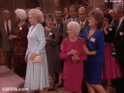 A Group Of People Are Standing In A Room With The Name Dr. Vaglish At The Top GIF