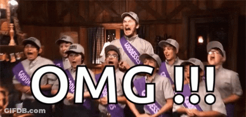 A Group Of People Are Standing In A Room With The Word Omg Written On The Bottom GIF