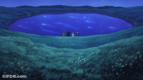 A Group Of People Are Standing In Front Of A Blue Lake GIF