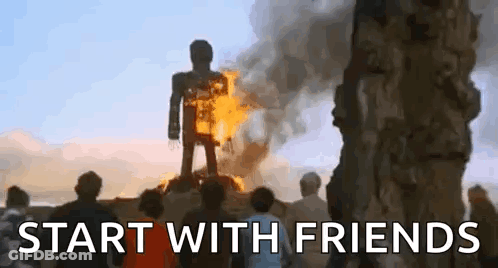 A Group Of People Are Standing In Front Of A Burning Statue Of A Man . GIF