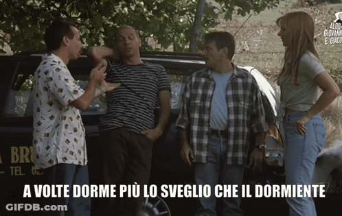 A Group Of People Are Standing In Front Of A Car That Says Brio GIF