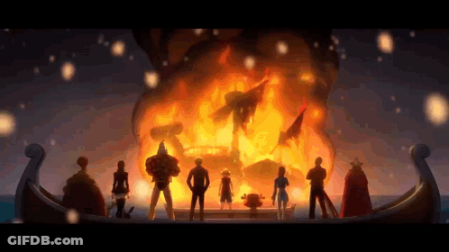 A Group Of People Are Standing In Front Of A Fire . GIF