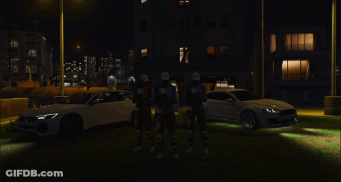 A Group Of People Are Standing In Front Of A Large Fire GIF