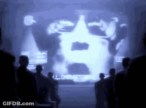 People Standing In Front Of Man's Face Screen GIF
