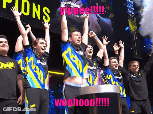 A Group Of People Are Standing In Front Of A Sign That Says Champions GIF