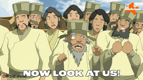 A Group Of People Are Standing In Front Of A Sign That Says " Now Look At Us " GIF