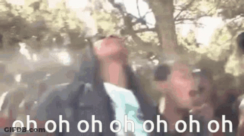 A Group Of People Are Standing In Front Of A Tree With Their Hands In The Air And The Words `` Oh Oh Oh Oh Oh Oh '' . GIF