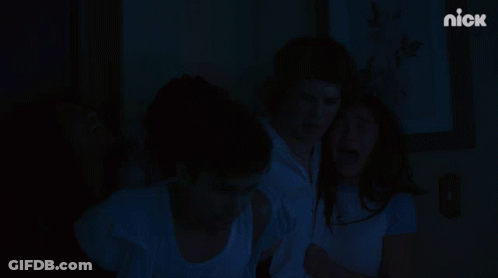 A Group Of People Are Standing In Front Of A Wall With A Nick Logo On It GIF