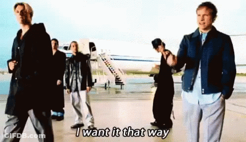A Group Of People Are Standing In Front Of An Airplane And One Of Them Is Saying I Want It That Way GIF