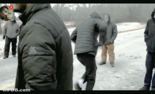 A Group Of People Are Standing In The Snow With The Number 1 In The Corner GIF