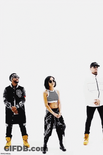 A Group Of People Are Standing Next To Each Other And One Of Them Has The Letter B On His Jacket GIF