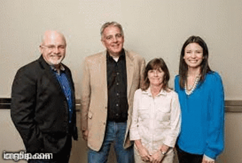 A Group Of People Are Standing Next To Each Other And Smiling For The Camera . GIF