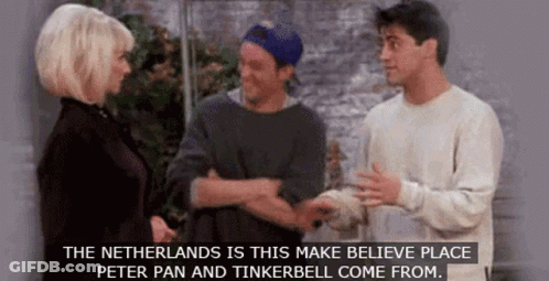A Group Of People Are Standing Next To Each Other And Talking About Peter Pan And Tinkerbell . GIF