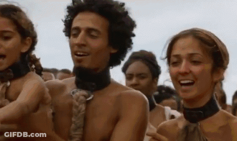 A Group Of People Are Standing Next To Each Other In A Crowd Without Shirts On . GIF